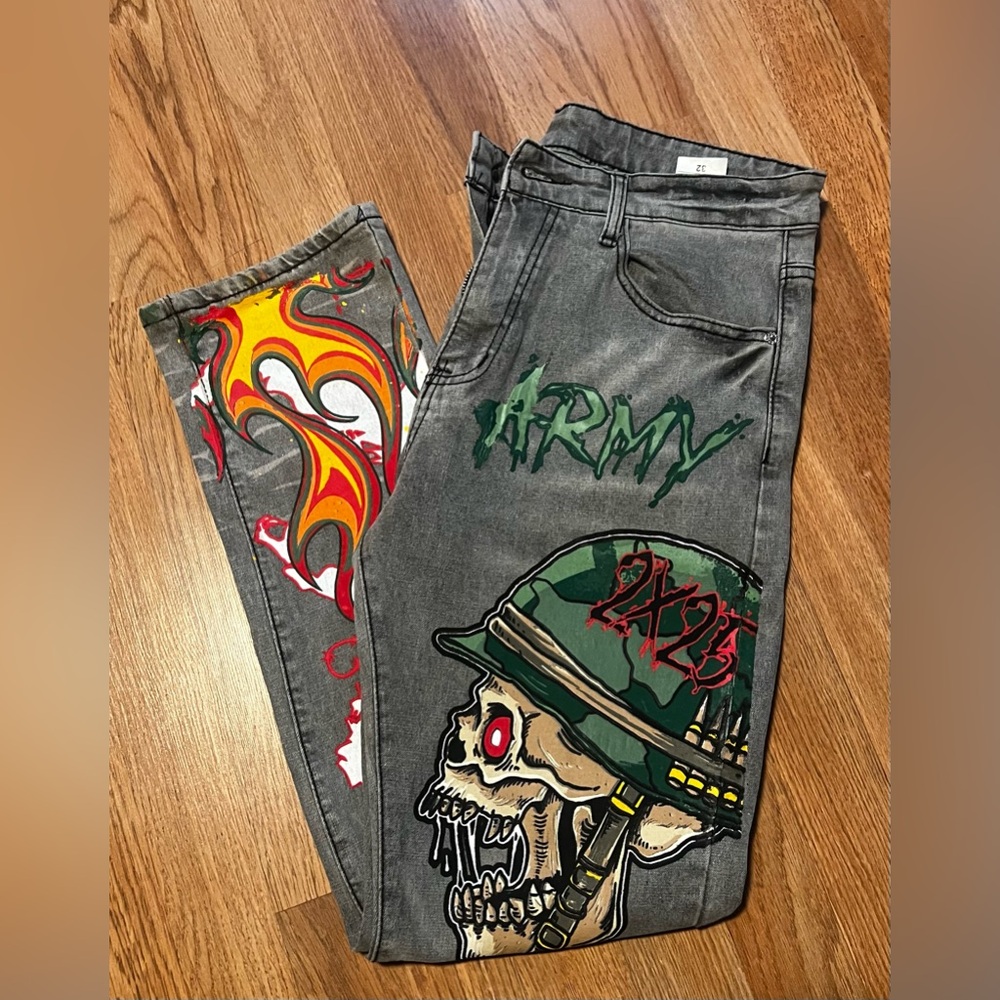 #8.    Gray Graphic Skull & Flame Jeans with Army Motif